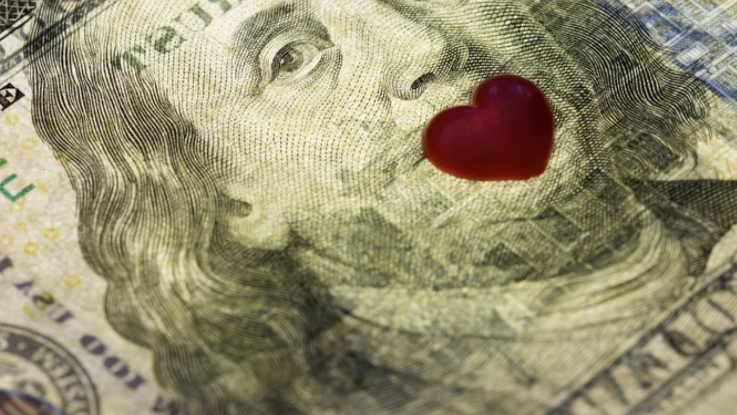 $100 bill with heart sign on its lips